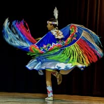 Traditional dancer in vibrant regalia