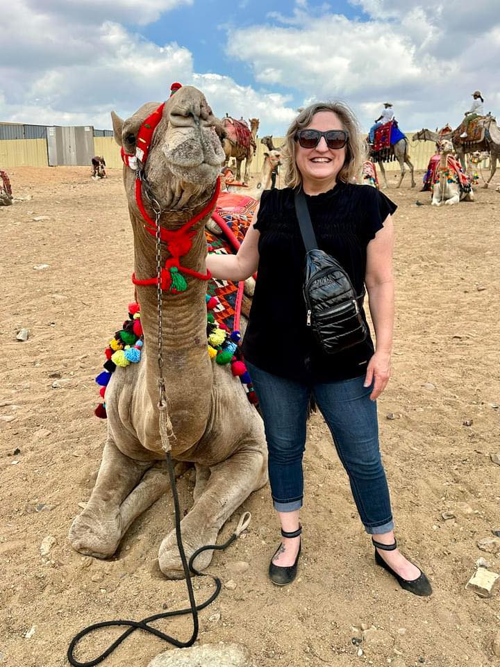 Kathy with a camel in Egypt